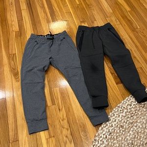 Two pairs of AE joggers.  Knee of dark grey joggers is slightly worn.